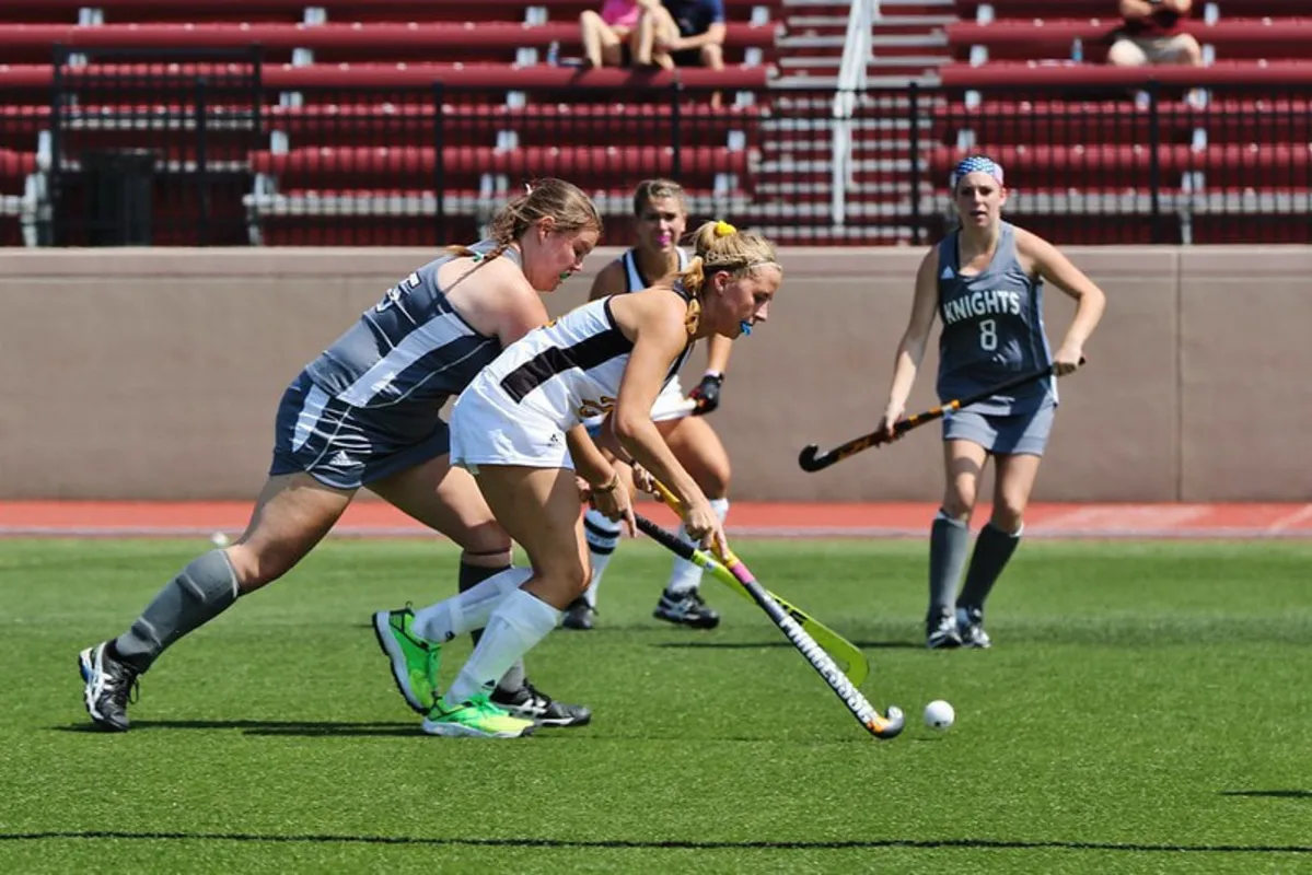Adult field hockey game in progress